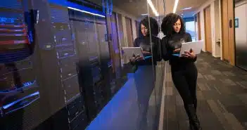 woman in black top using Surface laptop