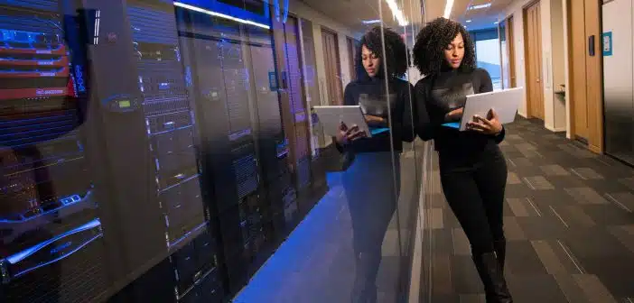 woman in black top using Surface laptop