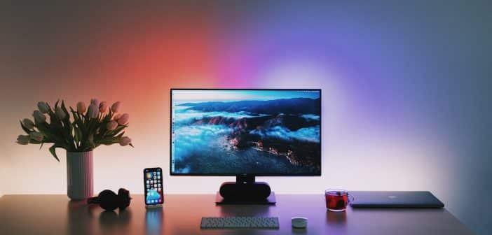 black flat screen computer monitor on brown wooden desk