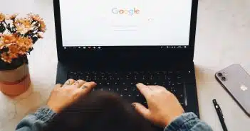 person using black laptop computer