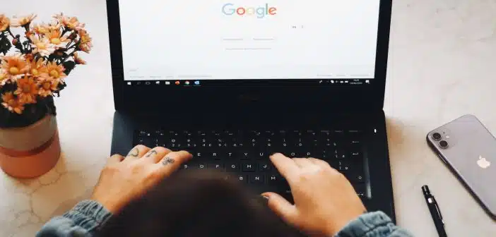 person using black laptop computer