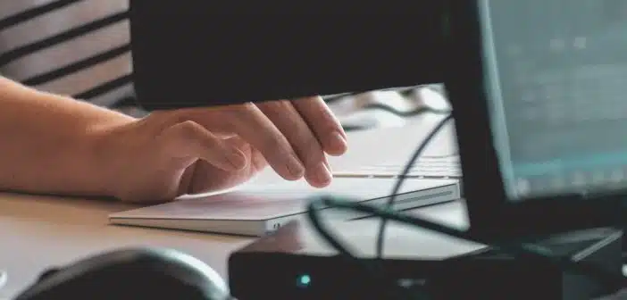 person using computer on table