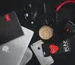 silver iPhone 6s near cup and MacBook